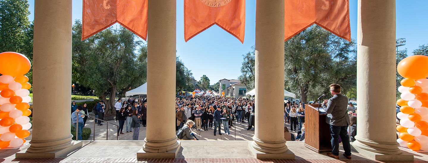 An Occidental staff member gives the welcome at an event for the Office of Admission
